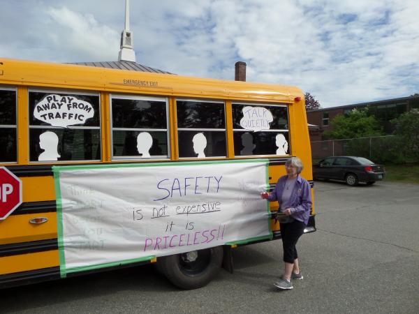 Doris with our float in the 2017 Kiwanis Spring Festival Parade in Hardwick.  The theme was �Kiwanis & Communities Inspiring Children�s Safety.�  To follow that theme, Court members arranged to borrow a school bus from the local bus company, Wildcat Busing, and decorate the bus with safety quotes.  Joe Young, husband of Regent Jeannine Young, drove the bus in the parade.  The Court�s entry took third place.